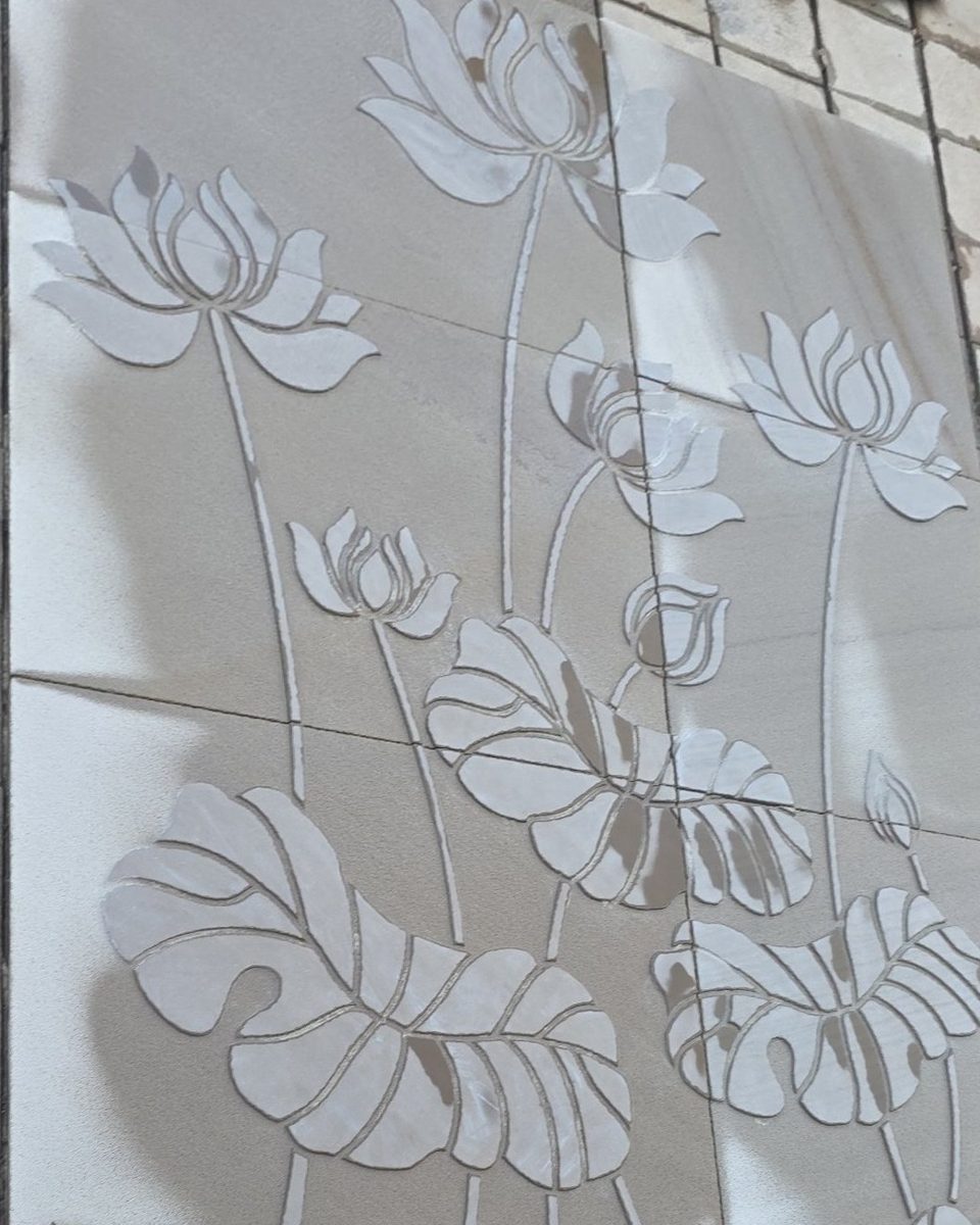 CNC-carved lotus wall panel in sandstone